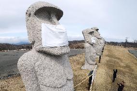 Masked moai statues in Sapporo