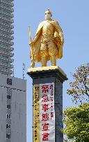 Mask-wearing Japanese warlord statue