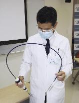 Japan's 1st heart valve implant inserting catheter from groin