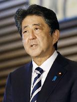 Japan enacts record extra budget