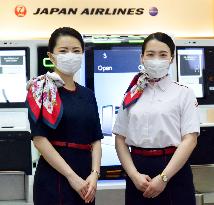 Airline workers' hospitality dilemma while wearing face masks