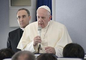 Pope Francis on his way home