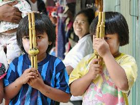 Thai kids playing Khene mouth organ