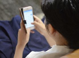 Student using smartphone