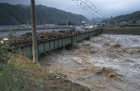 River flooding reported as heavy rain hits southwestern Japan