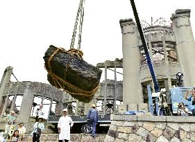 Part of Atomic Bomb Dome raised from river