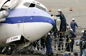 Japan, Taiwan examine plane at Naha airport