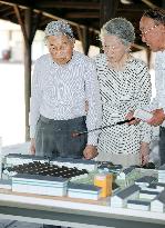Emperor, empress visit former silk mill in central Japan