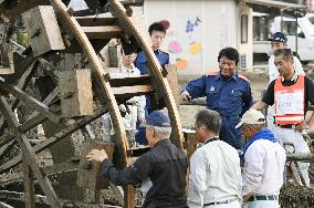 Historic water wheels resume operation in southwestern Japan