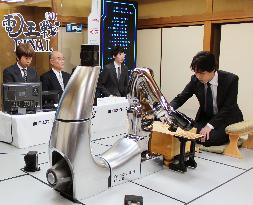 Pro shogi player beats computer program