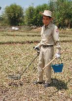 Laotians still imperiled by unexploded bombs 40 yrs after Vietnam War