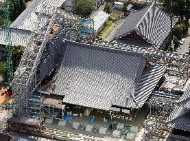 Refurbished roof of Kyoto temple hall shown