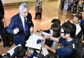 Japan soccer team returns after friendly against Iran