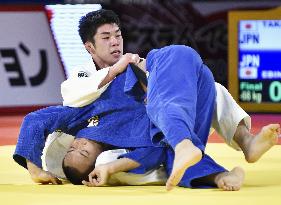 Takajo wins men's 66-kg title