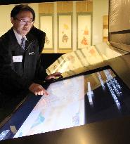 Touch-screen system shows scroll painting at new shrine treasure house