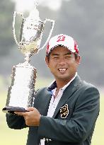 Yuta Ikeda holds trophy after winning KBC Augusta