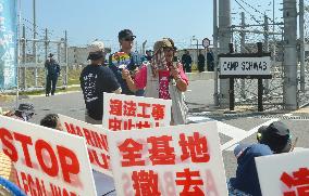 People protest as minister invalidates Okinawa decision