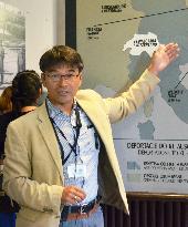 Sole Japanese tour guide at Auschwitz museum at work