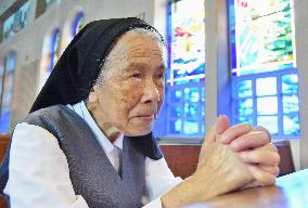 Catholic sister who survived A-bomb prays at Urakami Cathedral