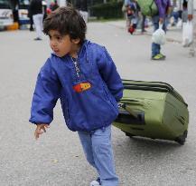 SNAPSHOT: Refugees making difficult journeys