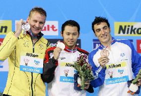 Kitajima wins 200m breaststroke in absence of archrival
