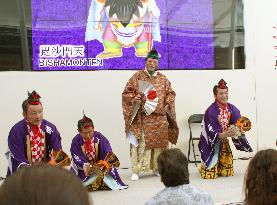 Japanese men perform good luck-inviting ritual at Expo Milano