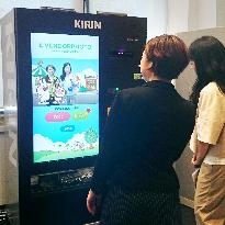 Kirin Beverage unveils vending machine with photo-taking function