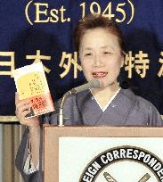 Mrs. Kan meets the press