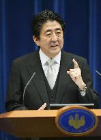 Japan PM Abe retains key ministers in Cabinet reshuffle