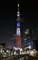 Tokyo Skytree lit up in blue, white, red in tribute to Paris victims