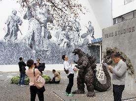 Godzilla greets visitors at film studio in Tokyo's movie town