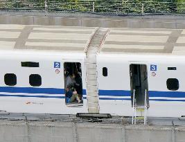 Shinkansen bullet train makes emergency stop due to smoke