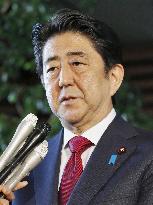 Japan to review Olympics stadium plan "from scratch": Abe