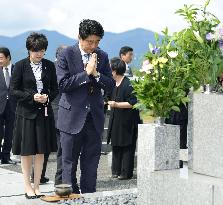 Abe visits father's grave