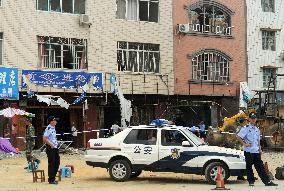 Police patrol explosion site in southern China