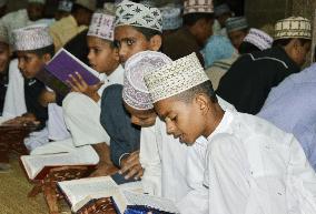 Islamic school students in Mumbai recite Koran