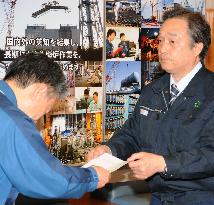 Futaba town mayor hands petition to TEPCO representative