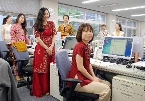 JICA staffers work in ethnic costumes of developing nations