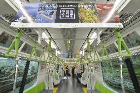 New Yamanote train has both digital, paper ads