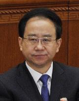 China removes ex-president's top aide from senior post