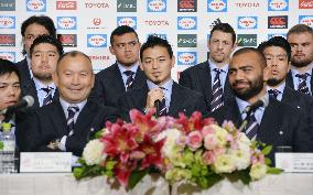 Japan rugby team returns home