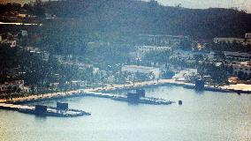 Submarines, warships seen anchored at Chinese naval base on Hainan