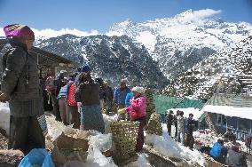 People gather at open-air market in Nepal