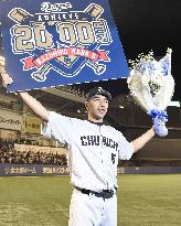 Japanese baseball player Wada poses after hitting 2,000th career hit