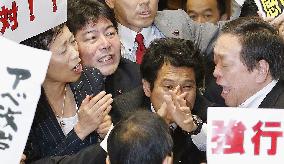 Japan's ruling camp rams security bills through Diet panel