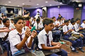 Indian students make paper cranes to pray for global peace