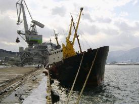 Wind-whipped freighter spills about 1,000 logs into Sea of Japan