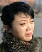 Young woman in Pyongyang reacts to Kim's death