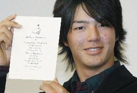 Ishikawa shows off Masters Tournament invitation