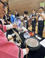 Visitors taste "somen" noodles from Kagoshima at Japan food fair in Beijing